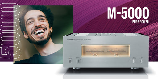 Yamaha M-5000 stereo power amplifier — hero shot showing illuminated VU meters and full front panel in Silver/Piano Black