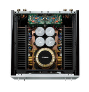 Yamaha M-5000 interior — massive toroidal transformer on 3mm pure-brass base with symmetrical MOSFET power stage layout