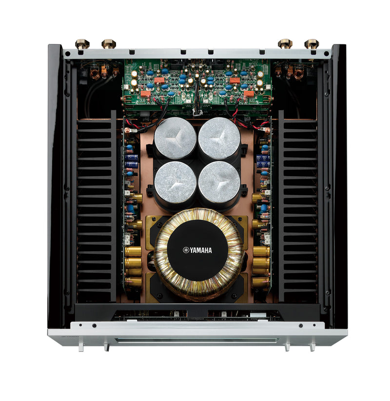 Yamaha M-5000 interior — massive toroidal transformer on 3mm pure-brass base with symmetrical MOSFET power stage layout