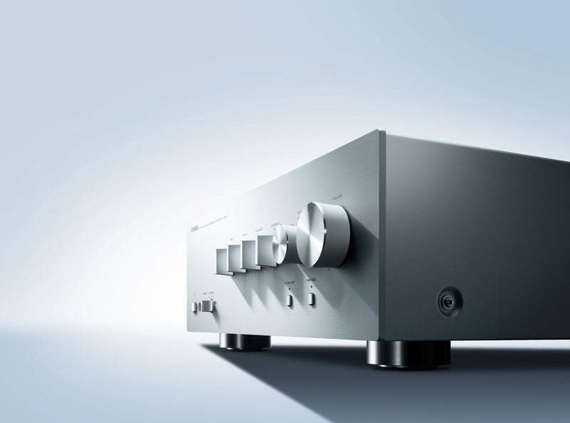 Yamaha A-S701 integrated amplifier — front panel detail showing volume, input selector, and Pure Direct controls