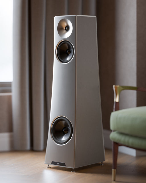 YG Acoustics Vesper 3 loudspeaker in silver, three-quarter view, in a furnished room